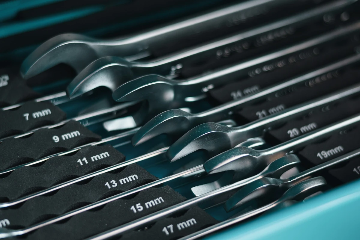 Close view of the size markings and natural chrome surfaces of combination wrenches